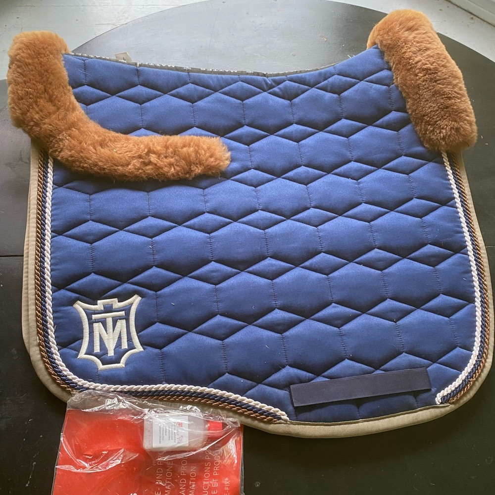 Blue large dressage mattes saddle pad with cognac colored sheepskin up top